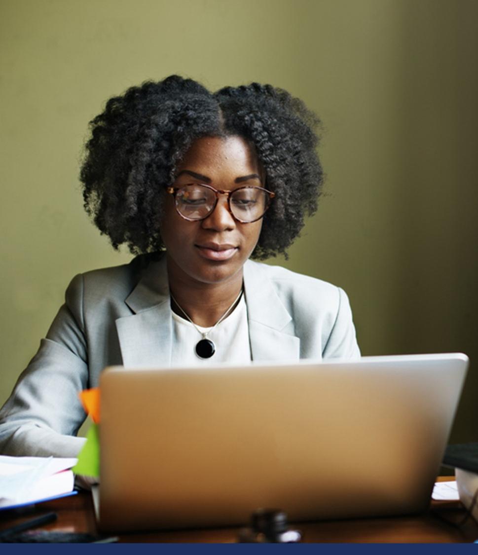 A woman typing on a computer